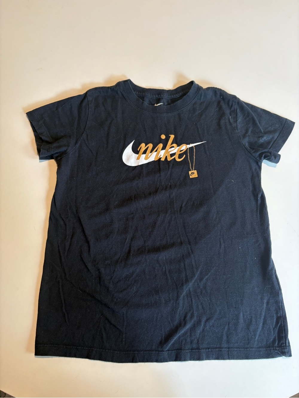 Girls Nike Black Short Sleeve Tee with White Swoosh and Gold Script